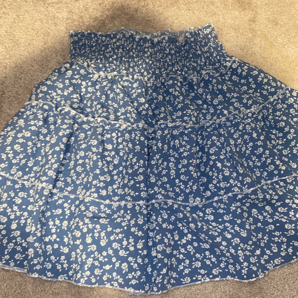 Blue skirt with white flower details